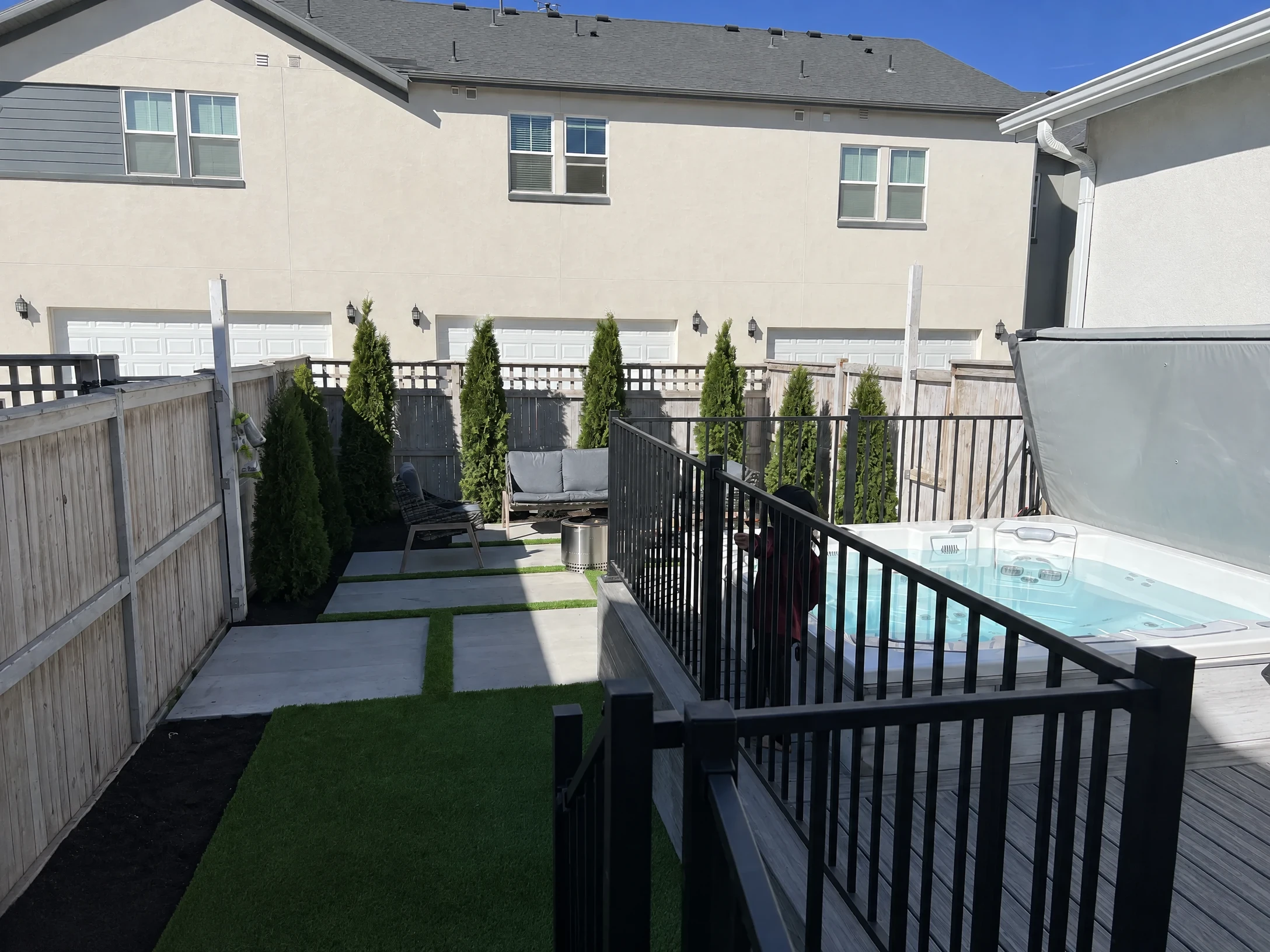 Trex composite deck with hot tub and artificial turf — Daybreak South Jordan