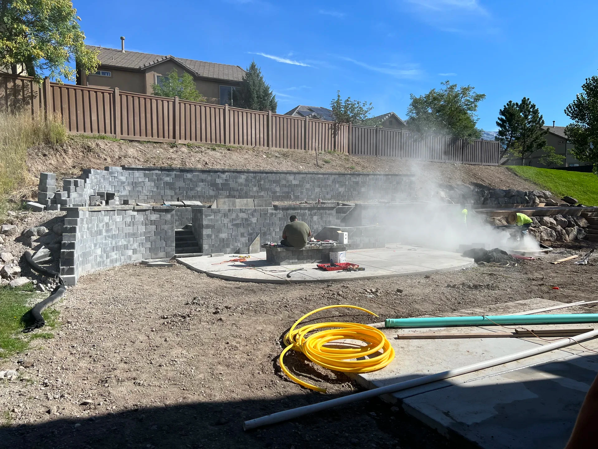 Belgard retaining wall block installation in progress — Draper, Utah backyard
