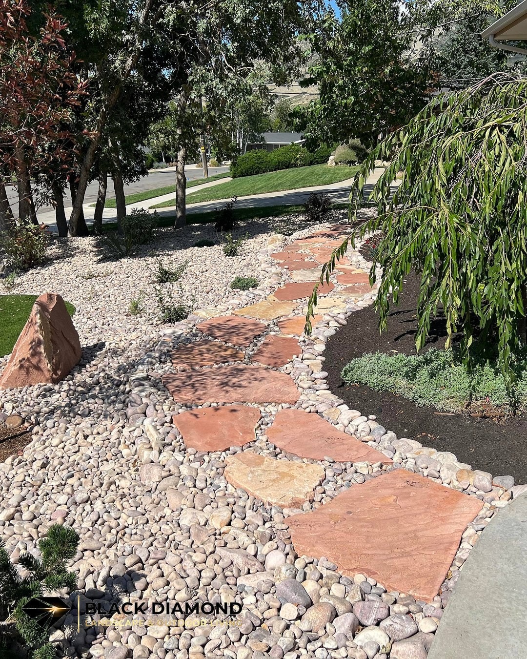 Emigration Canyon — flagstone path through river rock and low-water planting beds