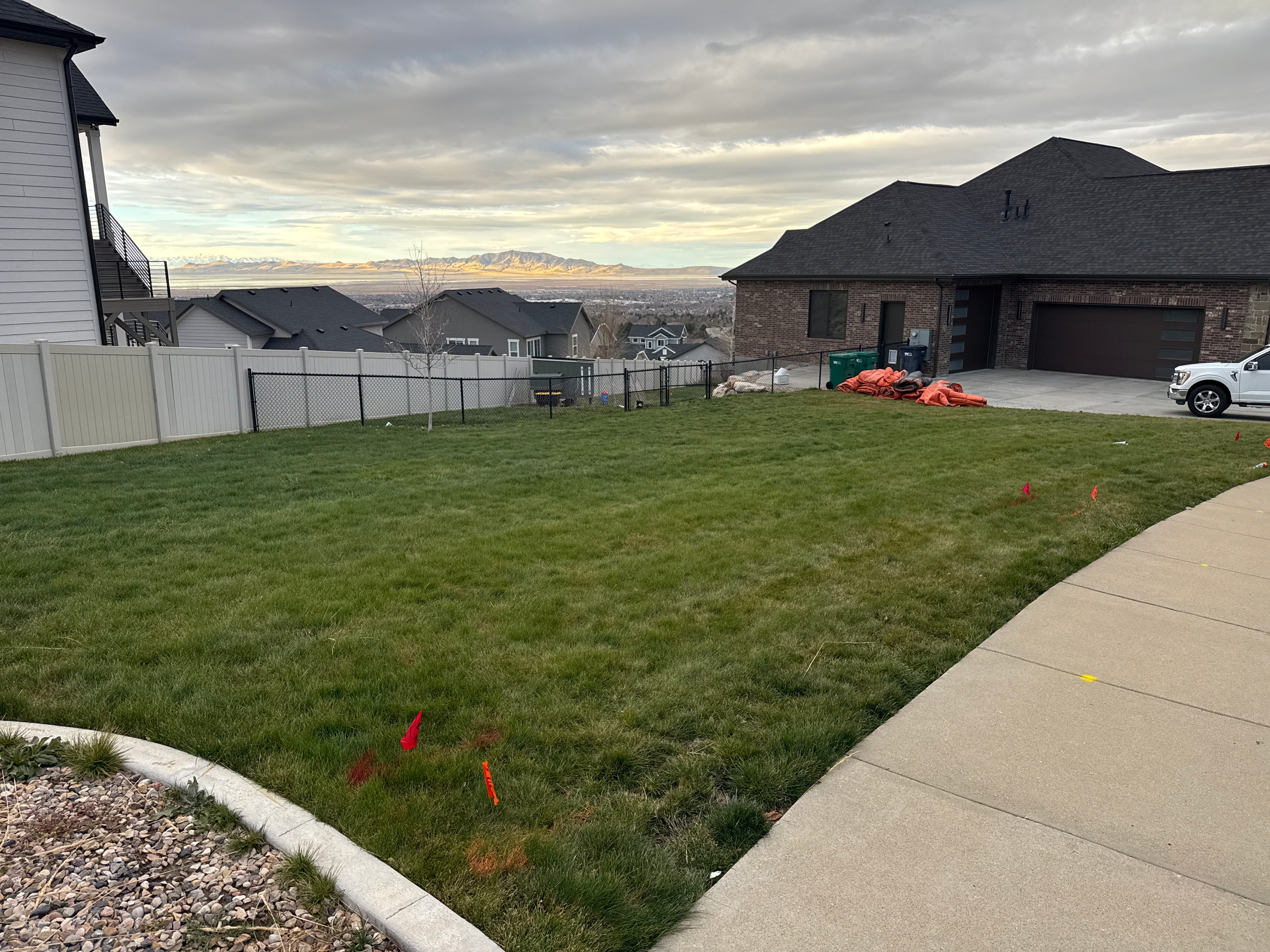 Utility-marked lawn before sport court and outdoor living construction in Layton, Utah