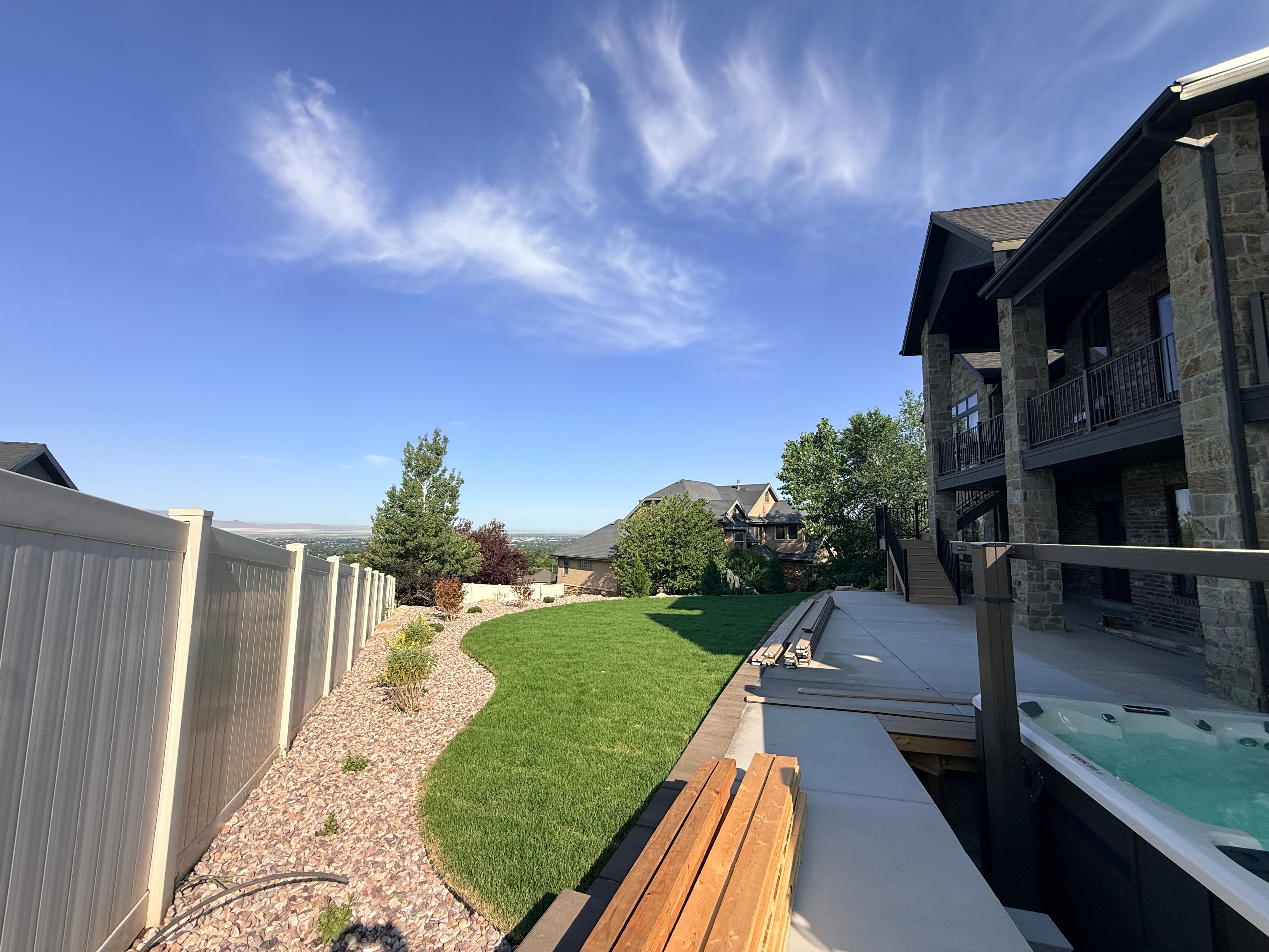 Swim spa, new lawn and Trex deck installation during a Layton outdoor living renovation