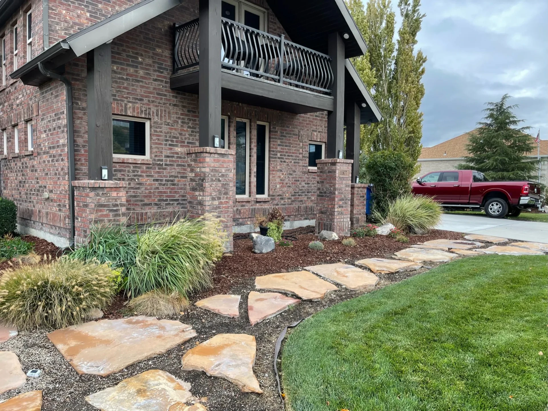 Aerial view of paver patio with fire feature and water feature in Riverton backyard