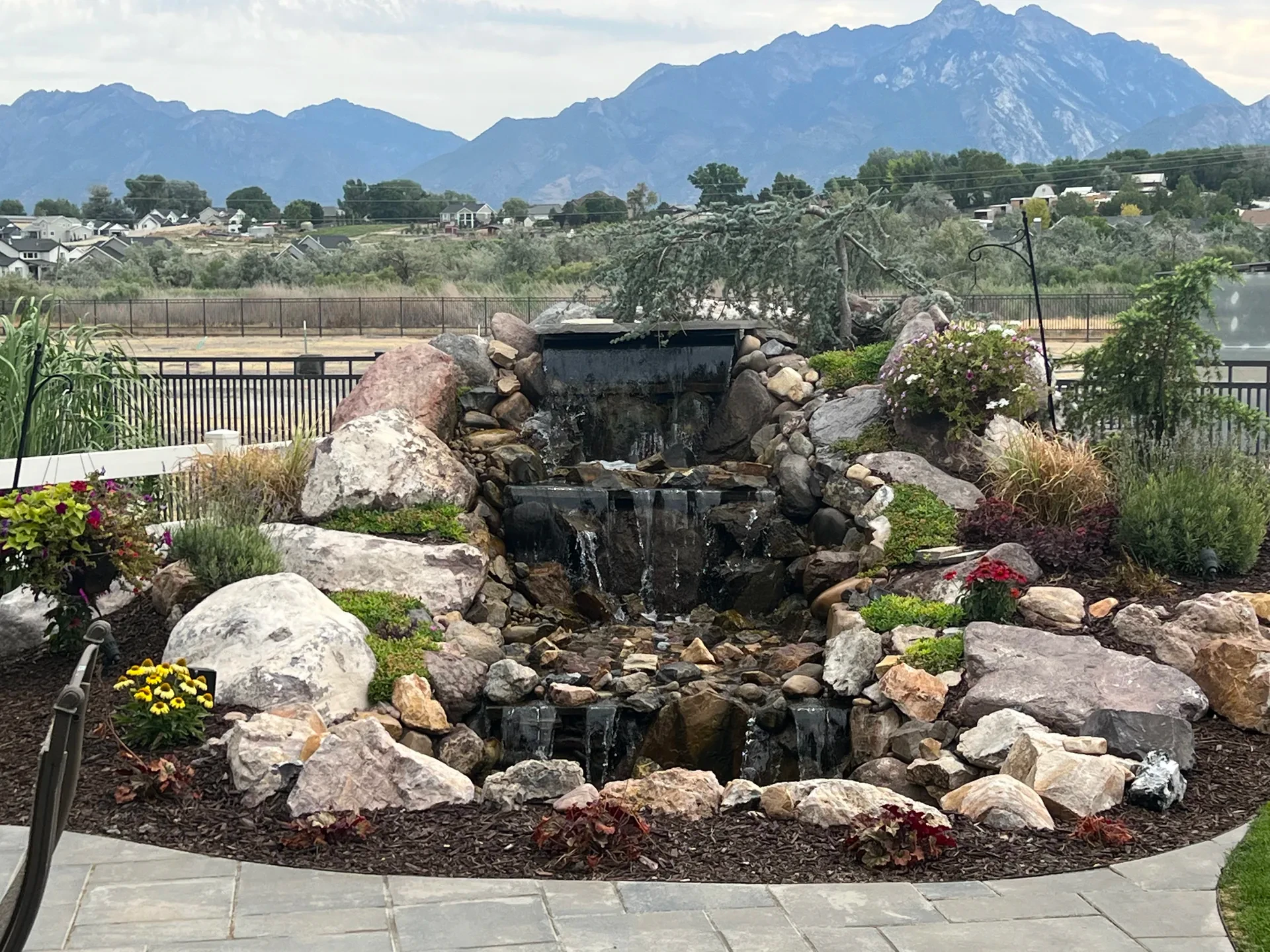 Close view of natural stone waterfall and pond