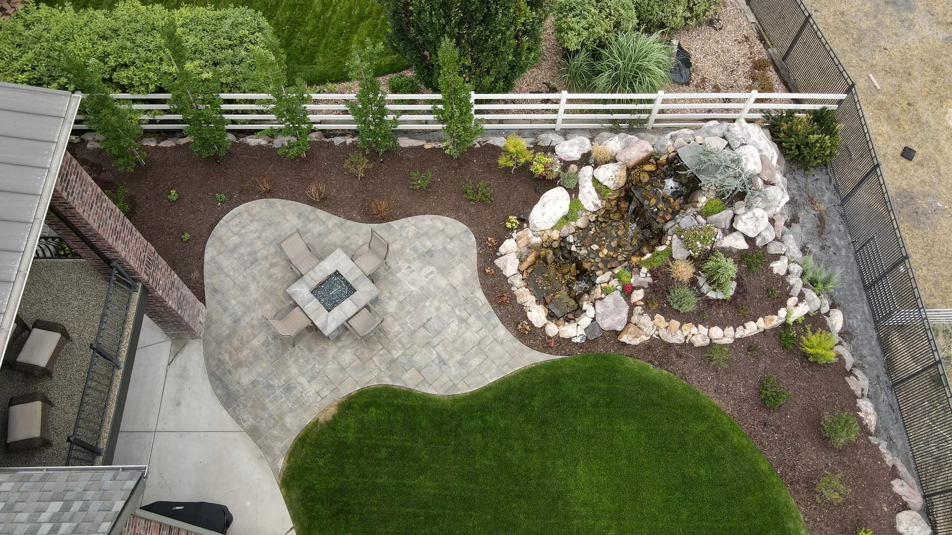 Natural boulder water feature with Wasatch Mountain backdrop
