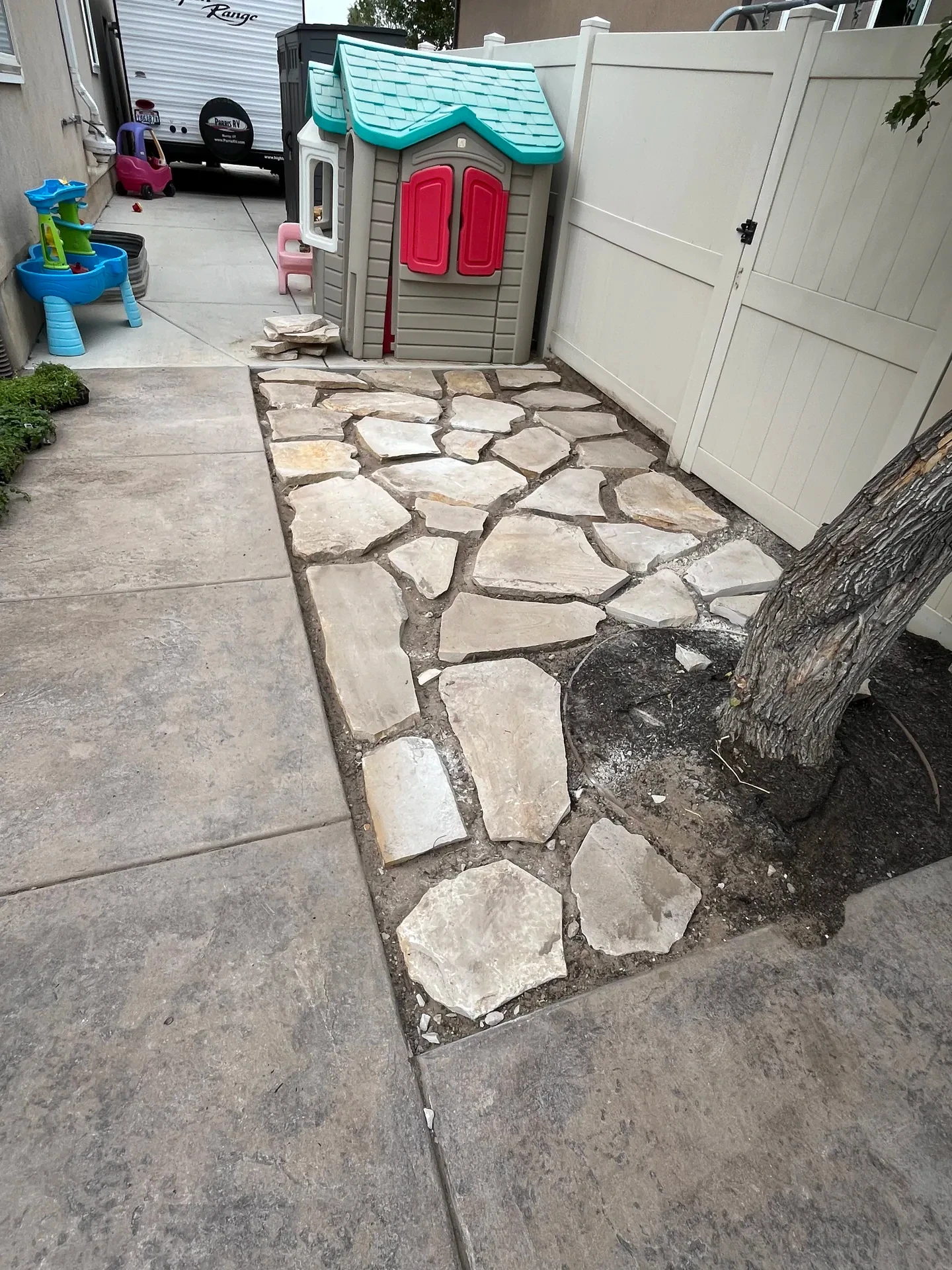 Natural flagstone side-yard pathway connecting the Sandy landscape renovation