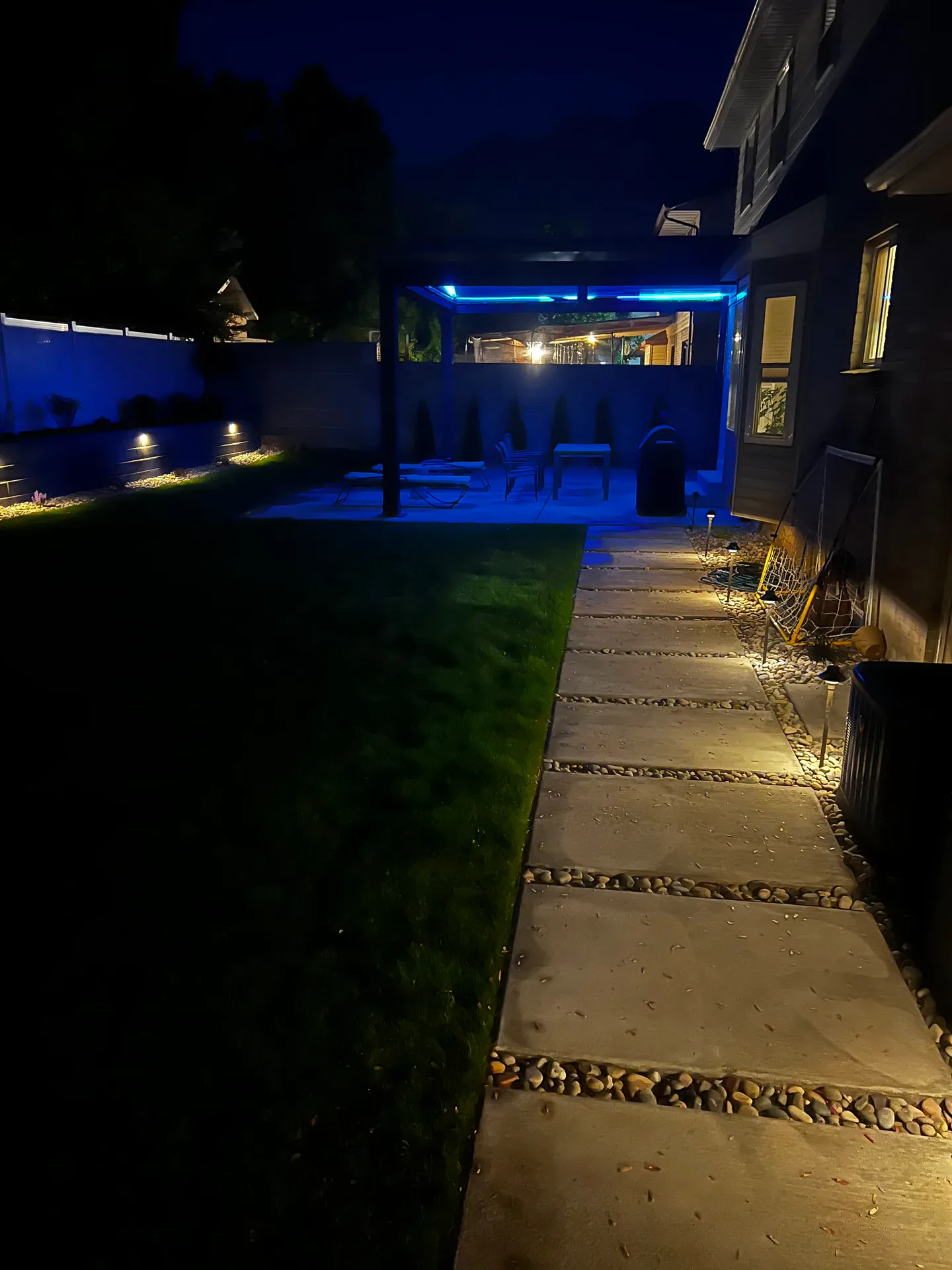 Illuminated approach to custom pavilion at evening, Sandy Utah