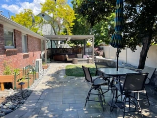 Custom pergola with fire feature and Belgard paver patio — Sandy, Utah