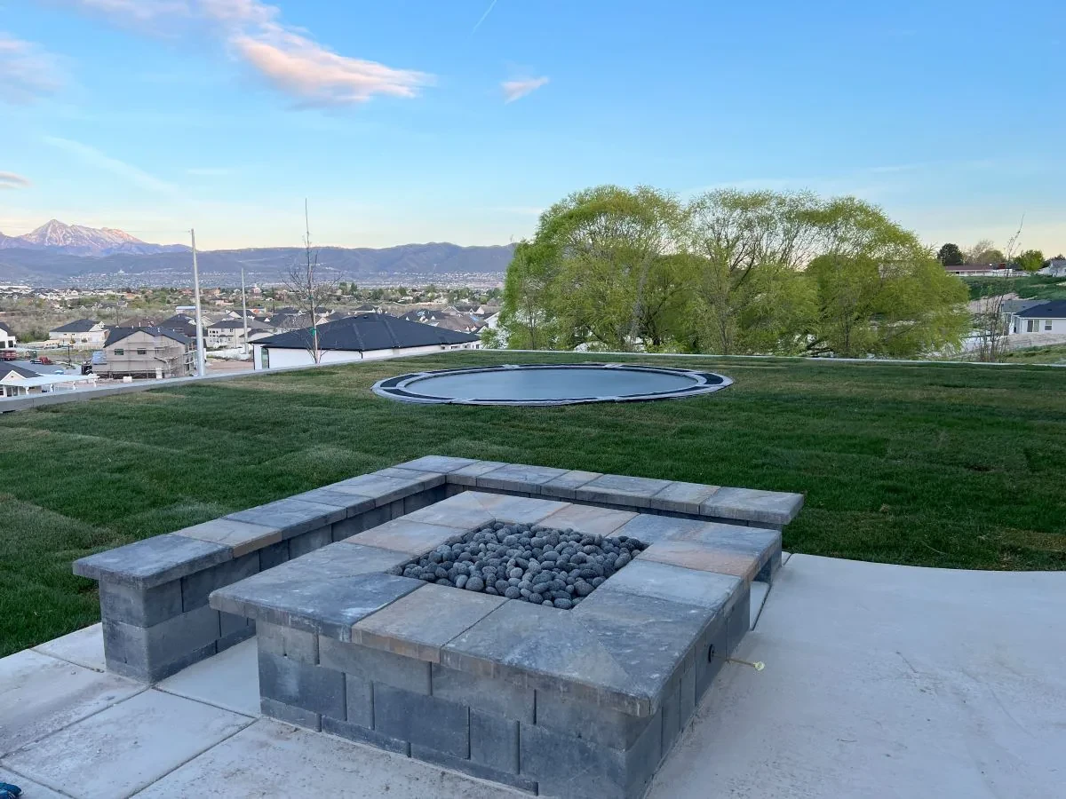 Custom fire feature with recreation landscape and mountain view in South Jordan, Utah.