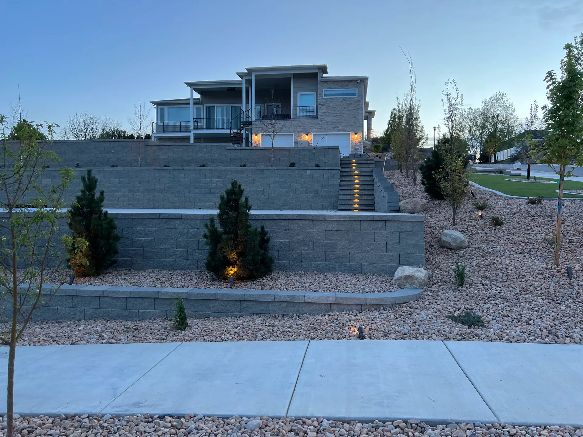 Landscape steps with retaining walls and low-voltage path lighting in South Jordan, Utah.