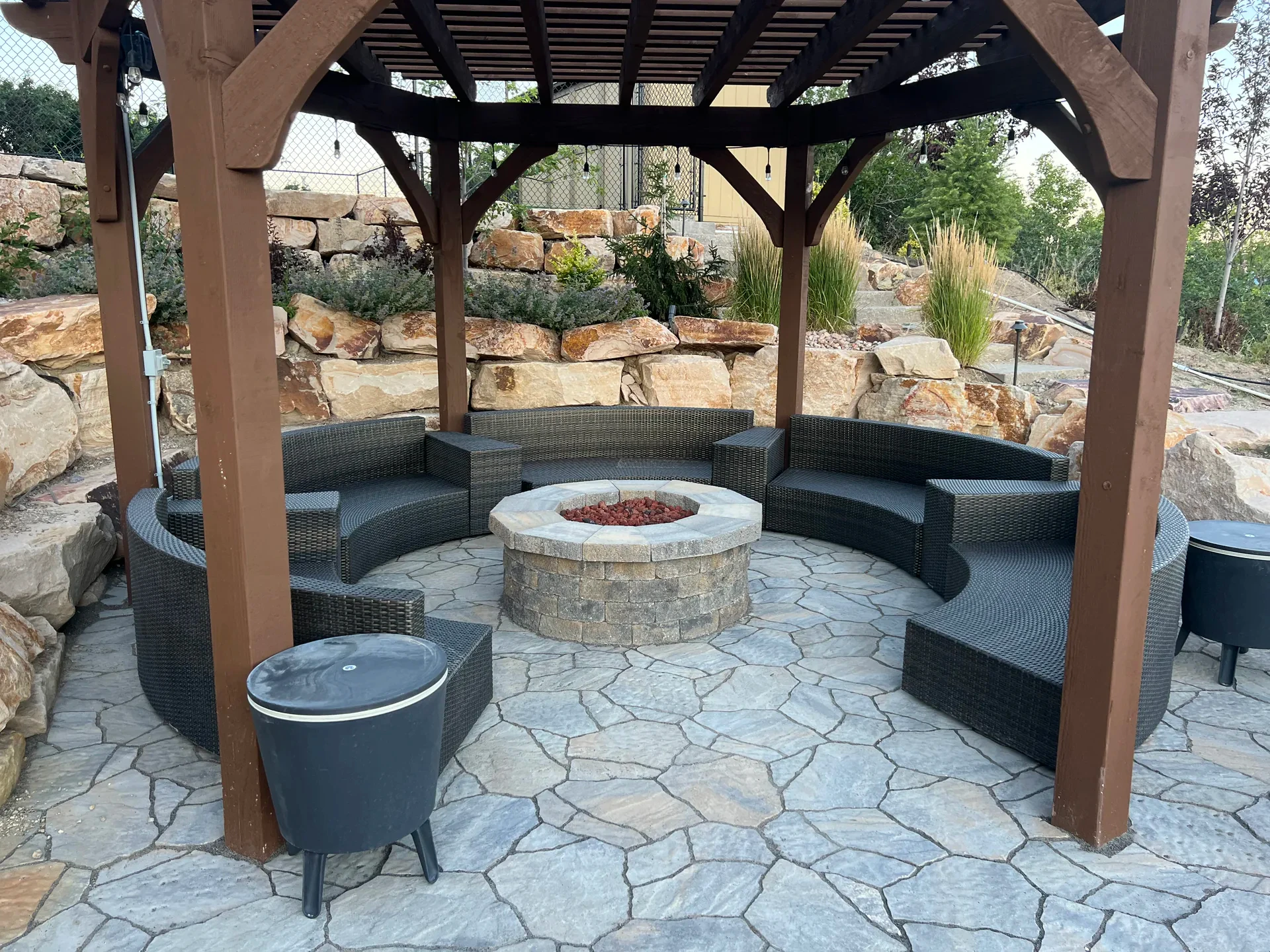 Custom pergola and circular fire feature in the Suncrest Draper outdoor living area