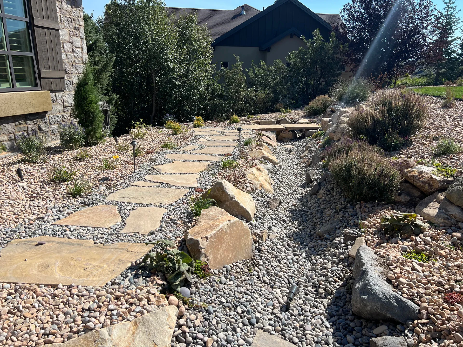 Natural flagstone pathway through a water-wise landscape in Suncrest, Draper Utah