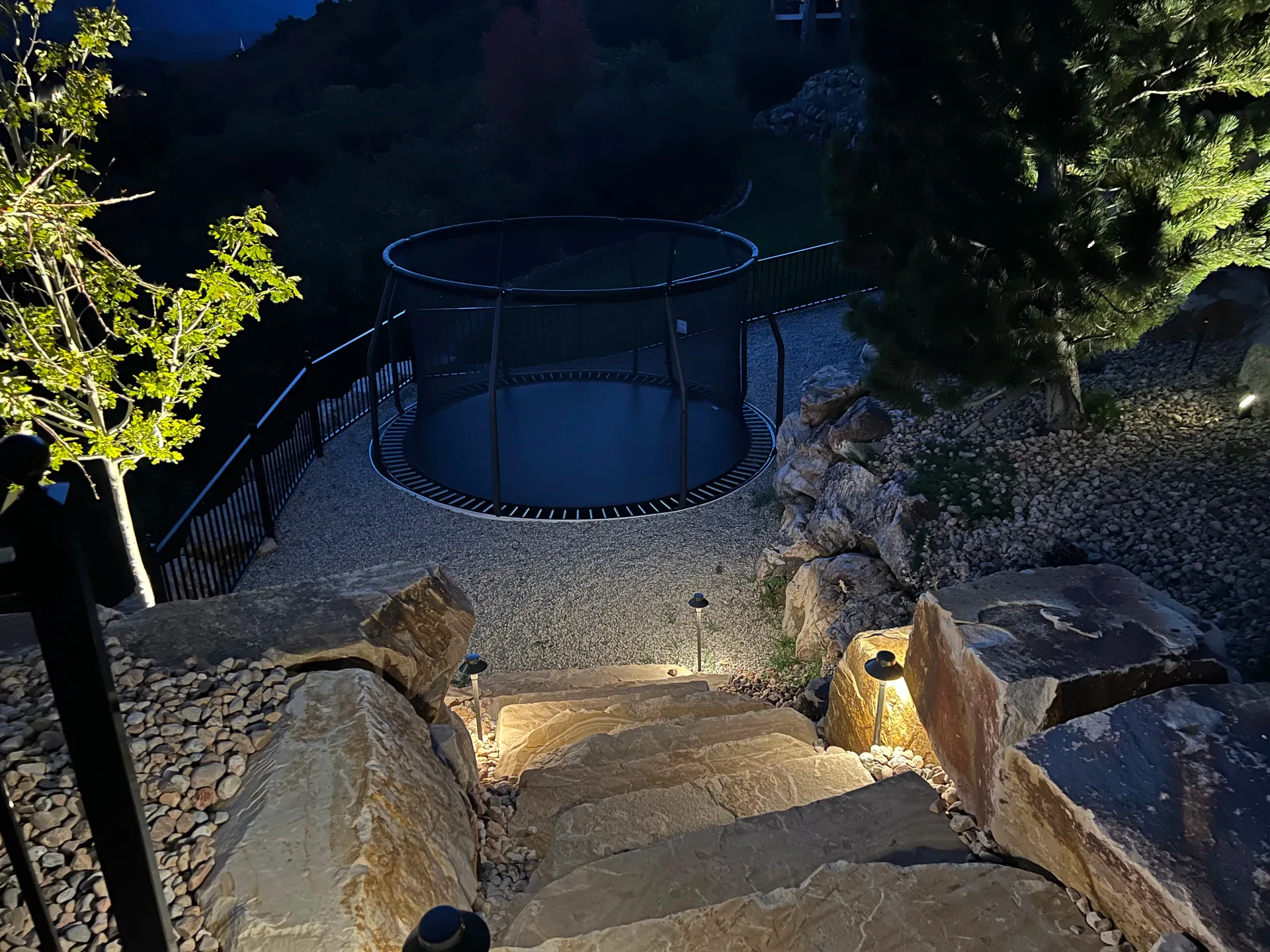 Natural stone steps and landscape lighting at night in Suncrest, Draper Utah