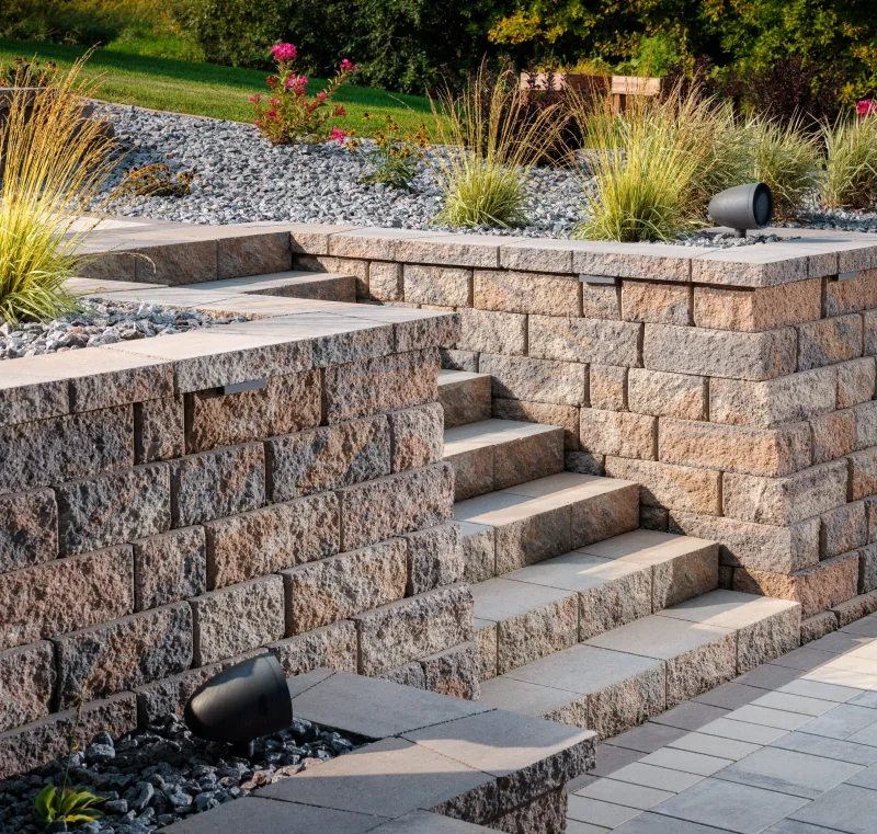 Belgard Dimensions 12 paver patio with Dimensions 6x9 accent and Highland Stone fire pit surround — manufacturer inspiration.