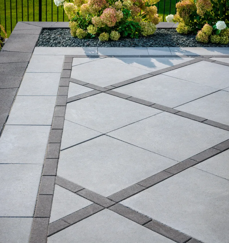 Belgard DimensionsSlab 24x24 patio with Dimensions 3x9 and 12x24 accent pattern — manufacturer inspiration.