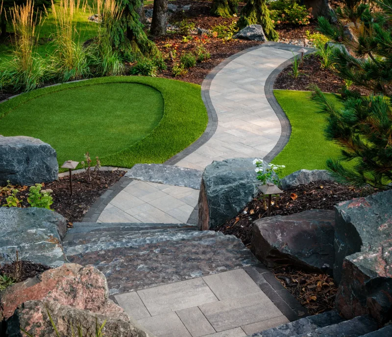 Belgard Origins 12 paver pathway with Brooklyn Paver dark border edging and path lighting — manufacturer inspiration.
