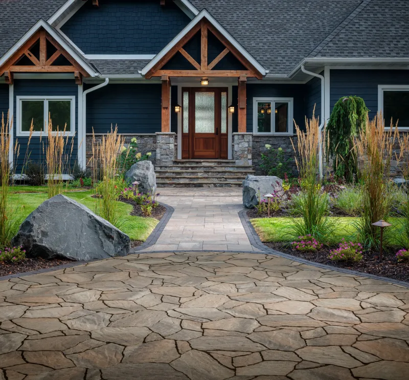 Belgard MegaArbel Aspen driveway apron with Origins 12 walkway and Brooklyn Paver border at modern home entry — manufacturer inspiration.